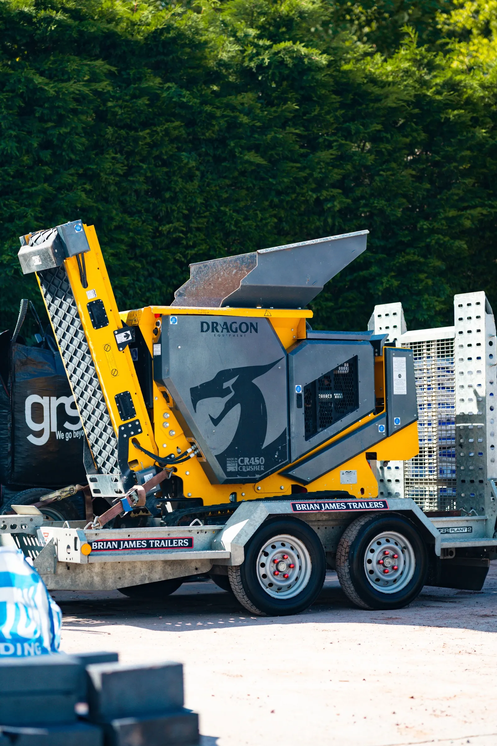 Rear view of the CR450 crusher strapped down on its delivery trailer