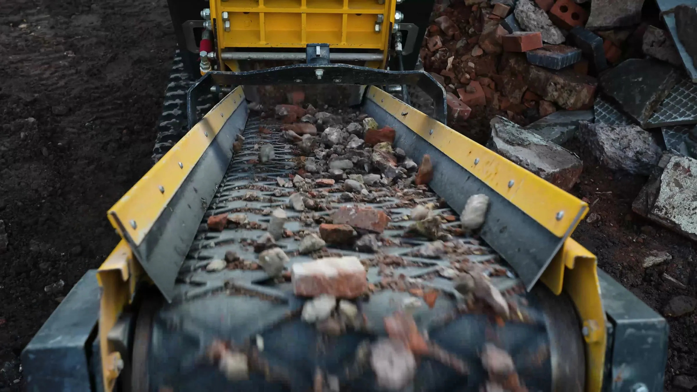 Crushed rubble running up the CR450 conveyor