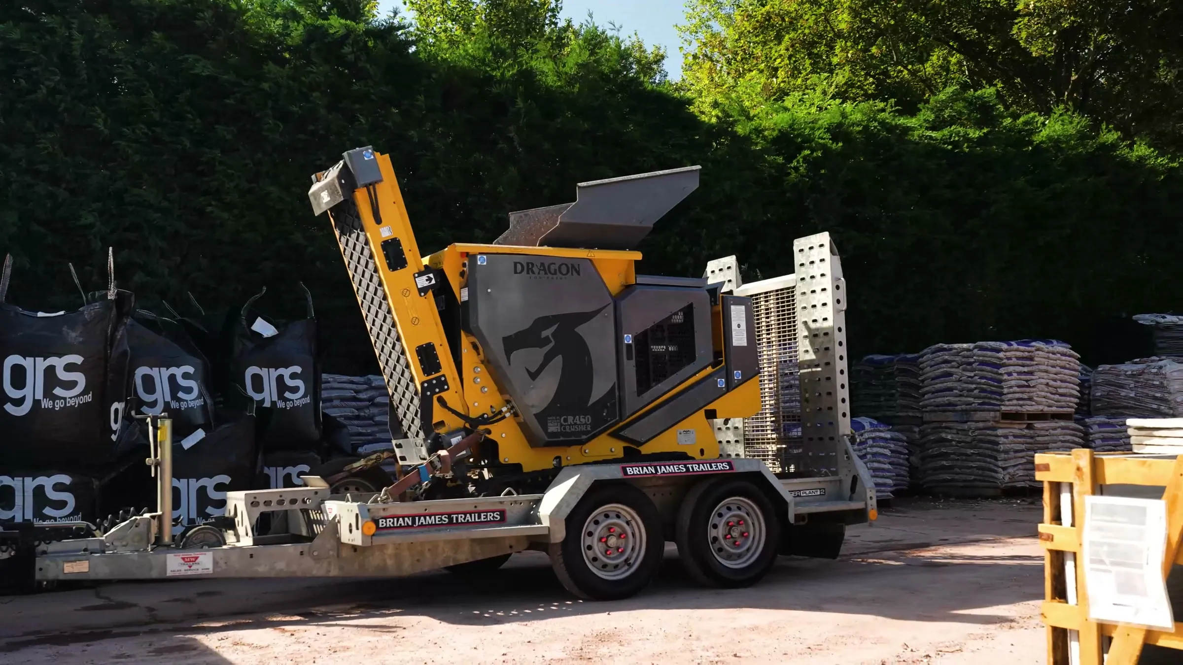 Dragon Equipment CR450 crusher strapped on its delivery trailer