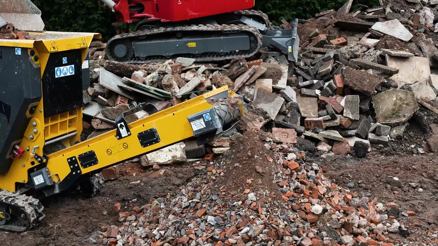 CR450 discharging crushed rubble on a construction site